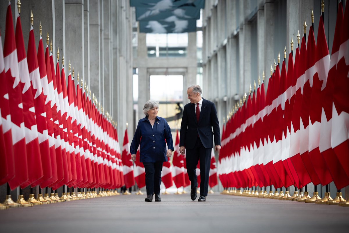Prime Minister Carney walks down a hallway with the Governor General-designate, the Honourable Louise Arbour, in Ottawa, Ontario.