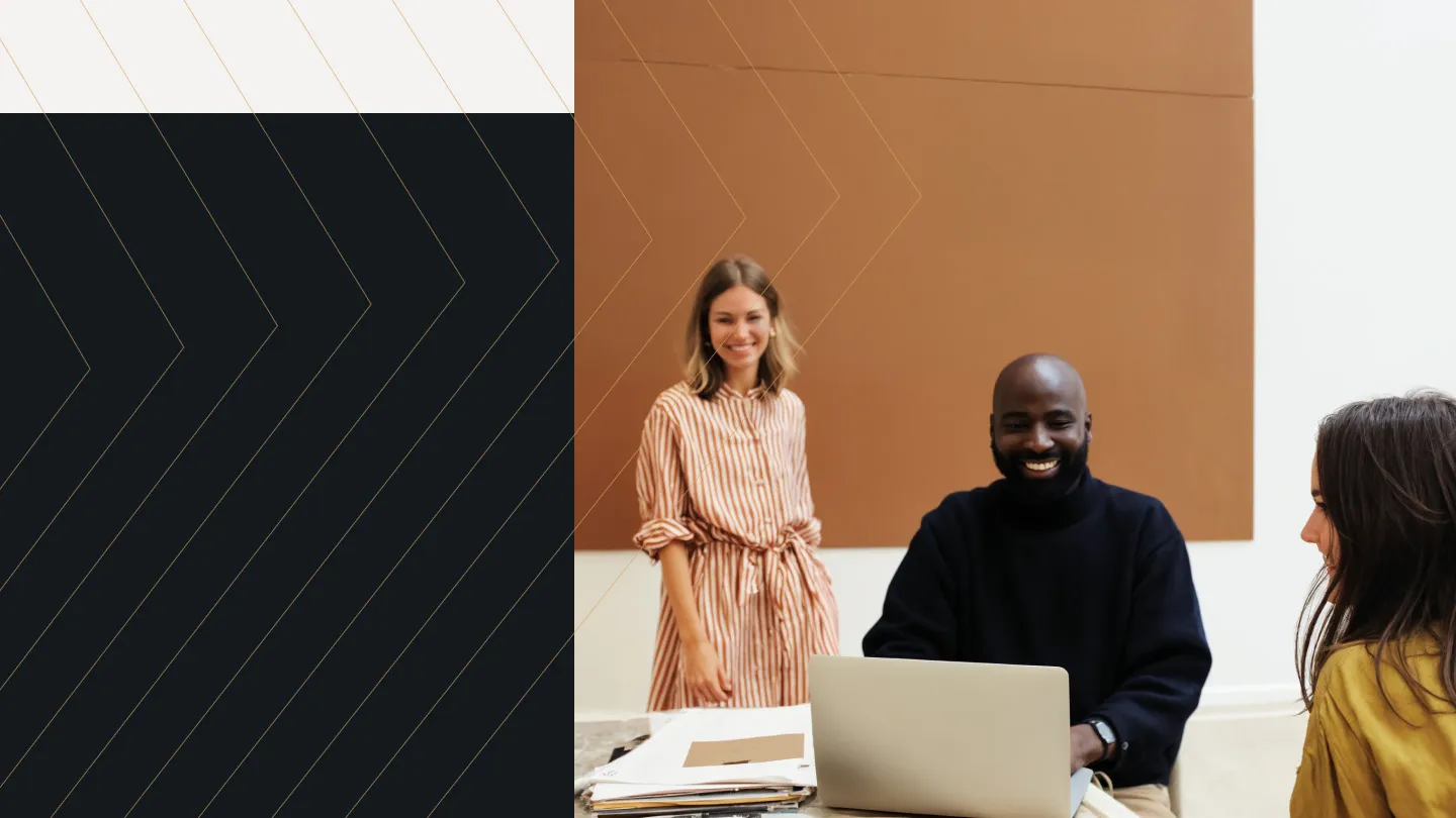 Three colleagues smiling during a relaxed creative session, next to bold geometric linework—representing VIP’s collaborative, expert-driven professional services approach.