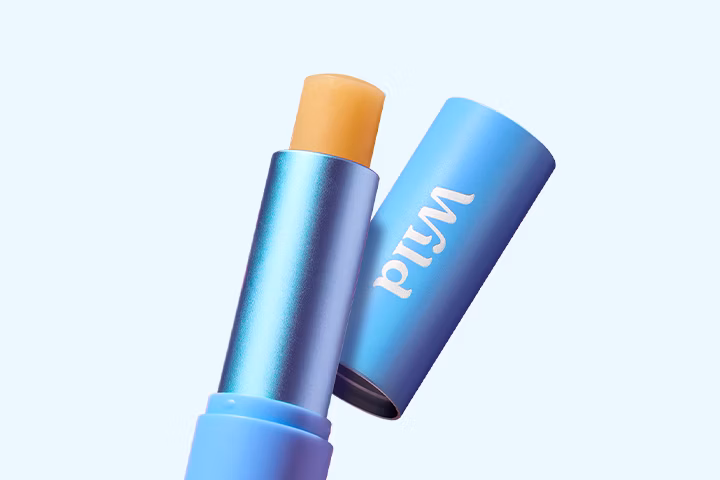 Caption: a close up of a blue tube of lipstick
