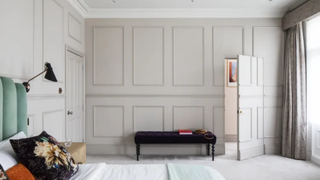 A wood panelled room with a concealed doorway