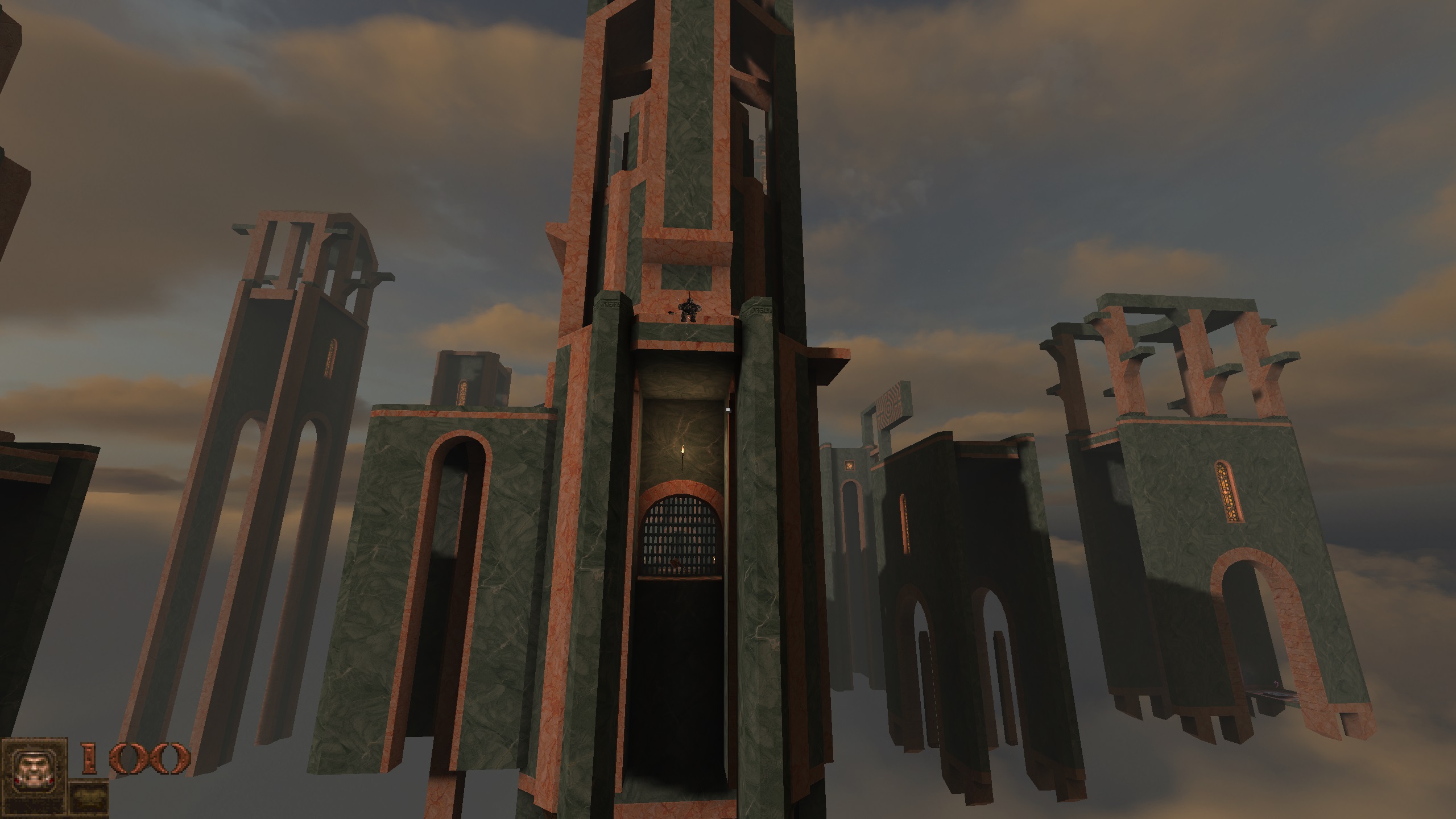 pink and green marble ruins rising before you in Quake