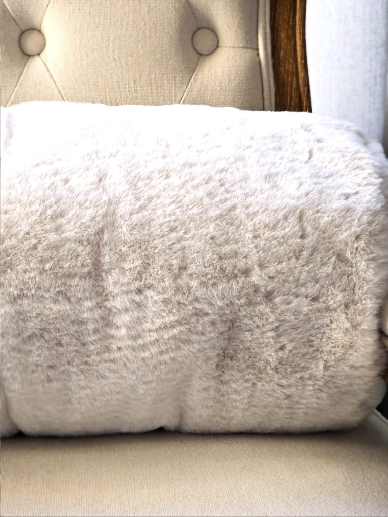 light-tan-fur-pillow-on-a-chair