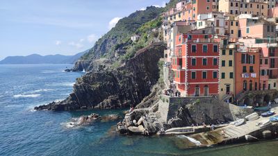 A picturesque view of the cliffside houses in Riomaggiore, one of the Cinque Terre's five villages.