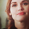 shopfront: Source: Teen Wolf. Close up of Lydia smiling with her chin raised. (TW - [Lydia] genius is sexy)