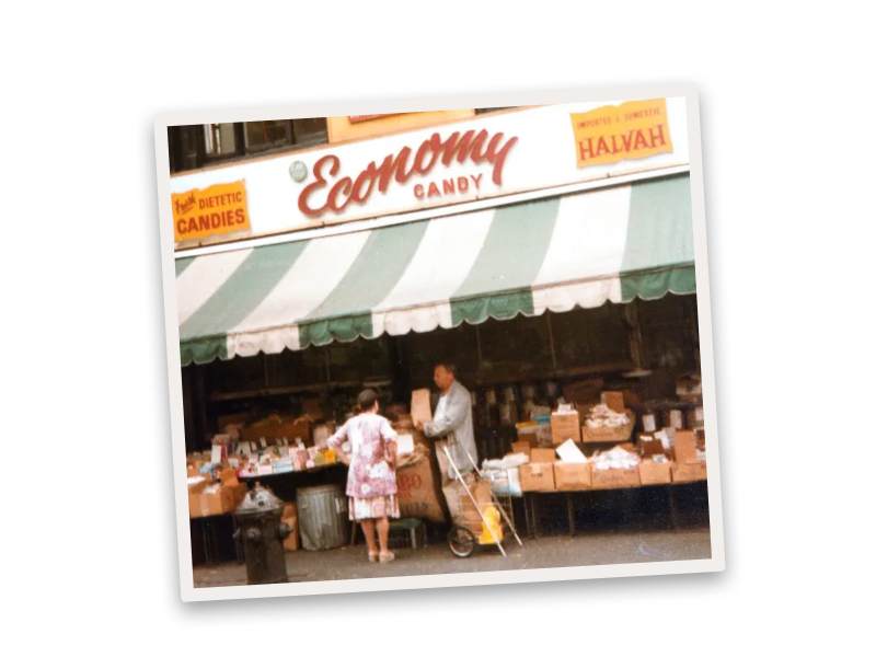 A photo of the Economy candy storefront on a background of jelly beans